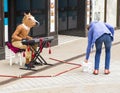 LEEDS, UK - 24 July 2015. Man with a horses head playing the ke