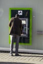 Lloyds Bank Cash Machine being used by asian man
