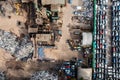 Aerial view directly above a scrap metal dealer recycling scrap vehicles