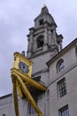 Vertical Image of Leeds Civic Hall to the right of a bright golden clock