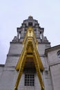 Vertical Image of Leeds Civic Hall underneath a bright golden clock Royalty Free Stock Photo