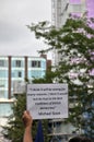 An arm holding up a sign with a quote form michael gove at the leeds for europe anti brexit demonstration