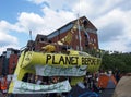 The large yellow boat banners and people in the road at the extinction rebellion protest blocking victoria bridge in leeds