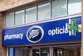 Sign green pharmacy cross above the boots chemists store in briggate leeds