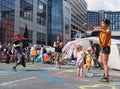 A woman blowing bubbles and people dancing at the extinction rebellion protest blocking the road at victoria bridge in leeds