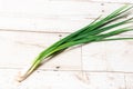 LeeLeek, large bunch of green onions on board, food, Close up chopped fresh spring onion on rustic wood table in top view flat lay Royalty Free Stock Photo