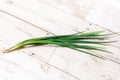 Leek, large bunch of green onions on board, food, Close up chopped fresh spring onion on rustic wood table in top view flat lay Royalty Free Stock Photo