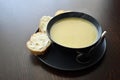 Leek and potato soup with bread and margarine. Royalty Free Stock Photo