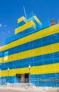 Town hall building wrapped in the colors of the Umrainian flag in protest of the Russian invasion