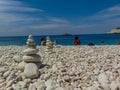 Stones balanced on beach