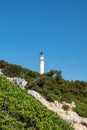 Lefkada island lighthouse on sea shore green cliff Royalty Free Stock Photo