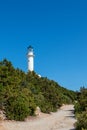 Lefkada island lighthouse on sea shore green cliff Royalty Free Stock Photo