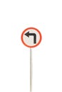 Left arrow with red edge circular badge with old rusted iron pole. Traffic sign signage. isolated with white background Royalty Free Stock Photo