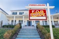 Left Facing Foreclosure Sold For Sale Real Estate Sign in Front of Home Royalty Free Stock Photo