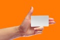 Left Female Hand Hold Blank White Card Mock-up. SIM Cellular Royalty Free Stock Photo