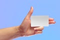 Left Female Hand Hold Blank White Card Mock-up. SIM Cellular Plastic NFC Smart Tag Call-card Mock Up Template. Credit Namecard or Royalty Free Stock Photo