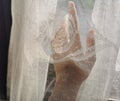 Left hand behind curtain Royalty Free Stock Photo