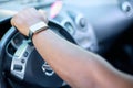 The left hand of a black man on the steering wheel of a car Royalty Free Stock Photo