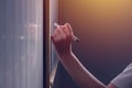 Left-hand female business person writing on office whiteboard