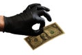 The left hand of a man in a black rubber glove holds one dollar with two fingers. Isolated on white background. Royalty Free Stock Photo