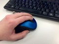 Left hand using a computer mouse