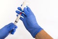 Left Handed Anesthesiologist Withdrawing Propofol into a Syringe