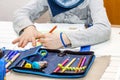 Left handed young boy working on his homework Royalty Free Stock Photo