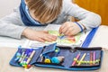 Left handed young boy working on his homework Royalty Free Stock Photo