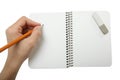 Left-hander writes in a notebook Royalty Free Stock Photo