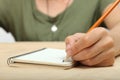 The left-hander writes in a notebook Royalty Free Stock Photo