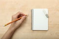 The left-hander writes in a notebook Royalty Free Stock Photo