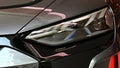 Left headlight of german battery electric executive car Audi RS e-tron GT displayed on motorshow in Bratislava, Slovakia.