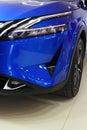 Left LED headlight and part of front mask of japanese battery electric compact crossover SUV Nissan Qashqai e-Power.