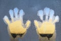 Left and Right Hand-prints on the frozen ice window Royalty Free Stock Photo