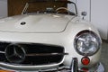 Left side front view of german luxury two door roadster Mercedes Benz 190 SL from year 1961, white colour