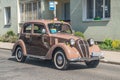 Vintage Italian brown Fiat 1500 driving