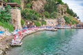 Left side of pier in harbor of old town of Kaleici with sun loungers and vacationers  Antalya  Turkey Royalty Free Stock Photo