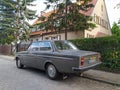 Classic vintage veteran youngtimer grey car Volvo 142 parked in an old street on pave stones