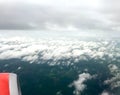 A left-side red airplane engine was working on the sky. Royalty Free Stock Photo