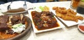 On the left side is a smoke rib with sambal, on the middle is spicy cooked ribs, the right one is fried mushroom