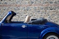 Left side view of navy blue classic convertible car Royalty Free Stock Photo