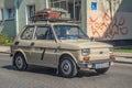 Classic small veteran vintage oldtimer Polish compact car Fiat 126p driving Royalty Free Stock Photo