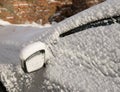 Left Wing right car mirror under snow Royalty Free Stock Photo
