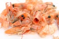 Leftover boiled shrimp on a white background.