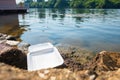 Leftover Foam Box on River Bank Royalty Free Stock Photo