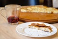 Leftovers of pizza dough and red tea on a table in cafe, food ending concept, cancellation of cafe visit