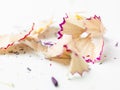 Leftovers from sharpening colored pencils, swarf on white background, copy space Royalty Free Stock Photo