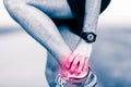 Leg ankle pain, man holding sore and painful foot Royalty Free Stock Photo