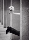 Leg of the bride and groom with a bouquet of hand