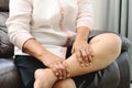 Leg cramp, senior woman suffering from leg cramp pain at home, health problem concept Royalty Free Stock Photo